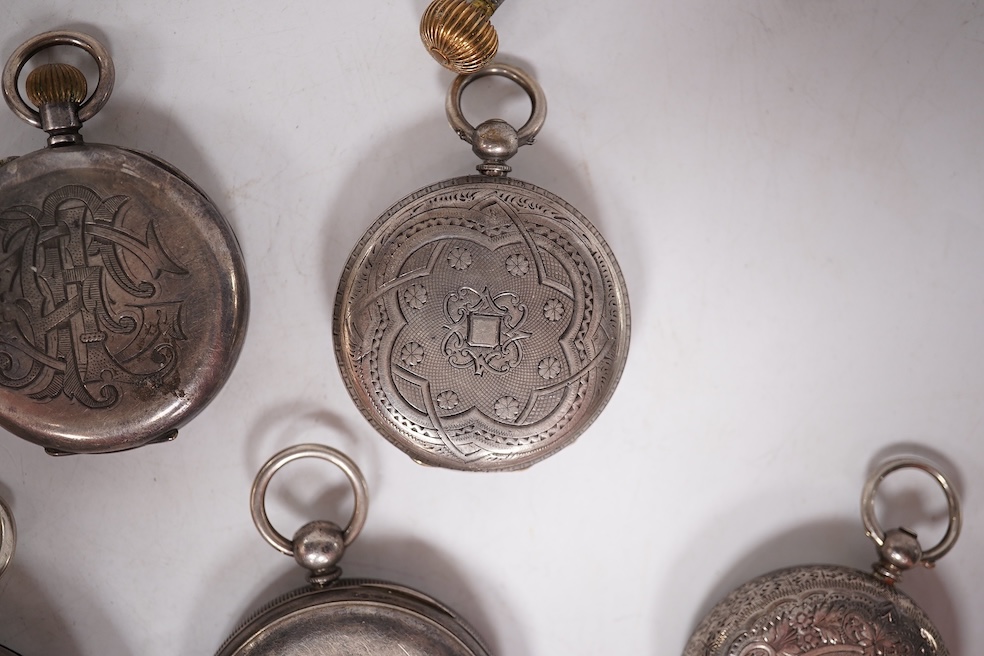 Three early to mid 20th century silver open faced pocket watches, with Roman or Arabic dials and subsidiary seconds, including two keyless and one key wind (Admiral Tacy Watch Co), together with one smaller silver open f